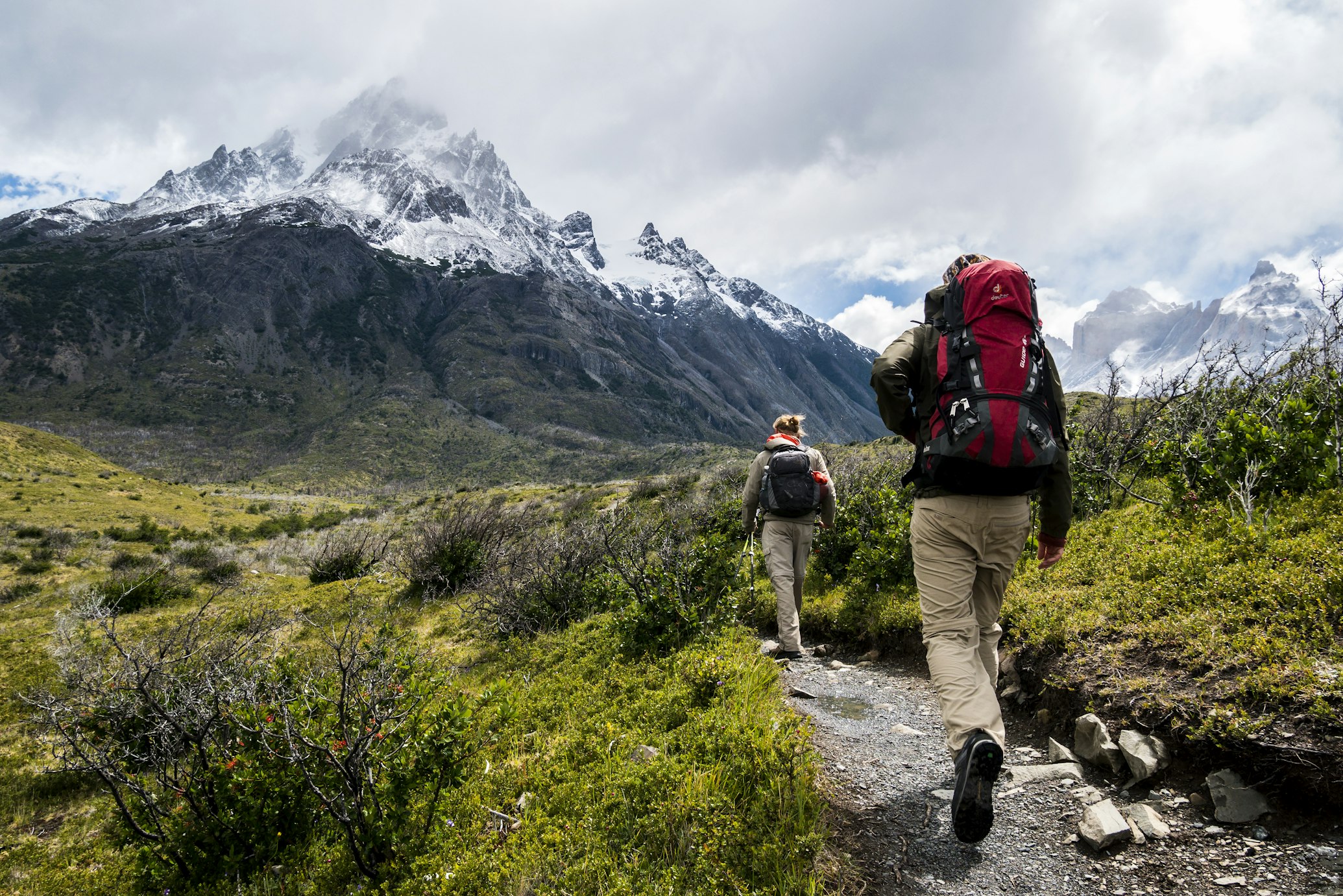 Ruckers walking with a weighted backpack on a mountain trail